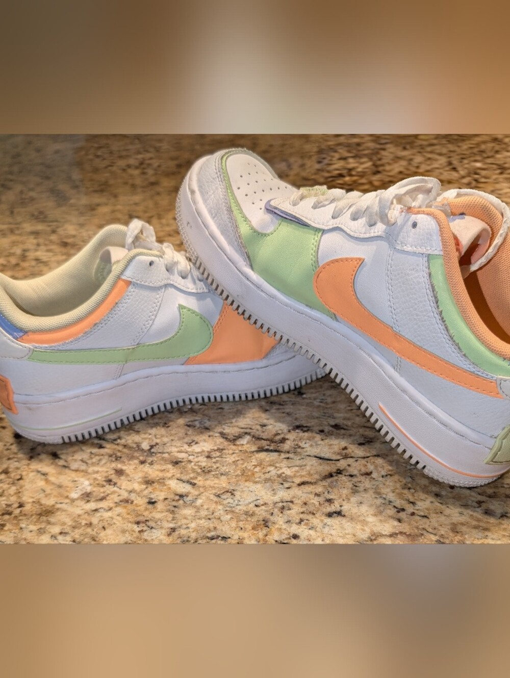 Nike Woman's White Sneakers with Pastel Green, Orange, and Purple Accents